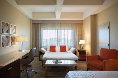 a hotel room with a bed and a window at Renaissance Orlando at SeaWorld® in Orlando