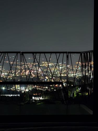 a view of a city from a balcony at night at BALCÓN DE SANTA MARÍA 1 uno in Dosquebradas