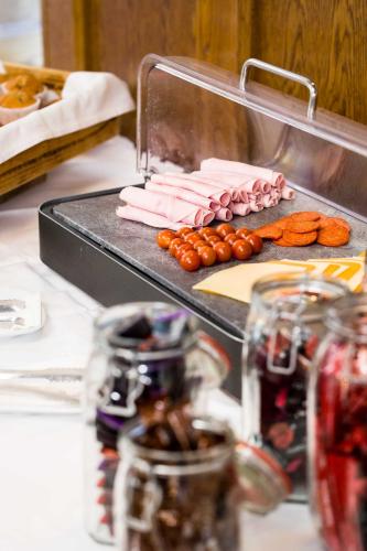 a grill with meat and vegetables on a table at Scott's Hotel in Killarney