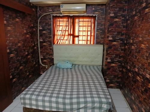 Postel nebo postele na pokoji v ubytování Citypark Cengkareng