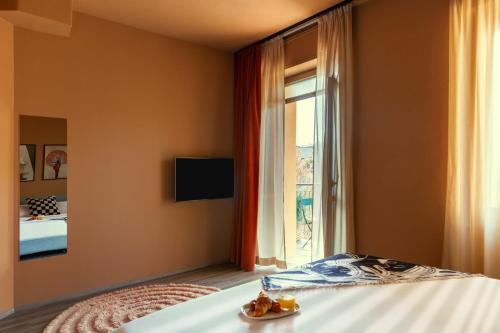 a bedroom with a bed and a window at Bob W Ticinese in Milan