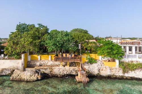 a resort with a slide in the water at Villa Seaside Boca Sami in Sint Michiel