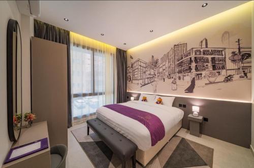 a bedroom with a bed with a drawing on the wall at SADEN Al-Salama in Jeddah
