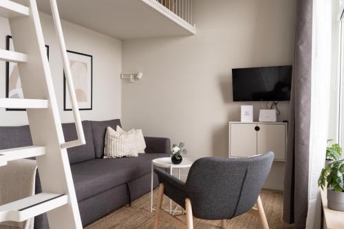 a living room with a couch and a table at Waterfront Cabins in Gothenburg