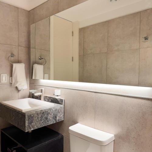 a bathroom with a sink and a mirror at Rossi Tiny in Villa Mercedes