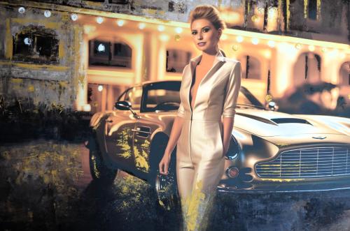 a woman in a white suit standing next to a car at Cinema City Hotel Europaplatz Karlsruhe - Brand New Boutique Hotel 2025 - in Karlsruhe