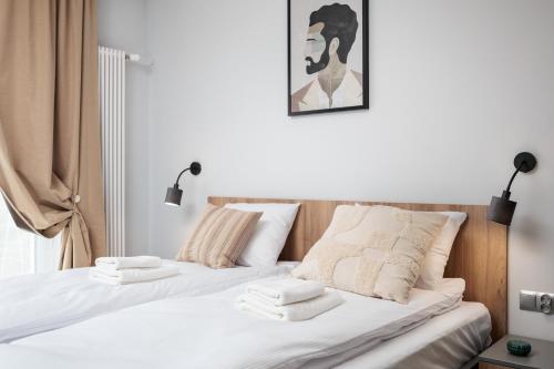 a bedroom with two beds with towels on them at Nowy Hotel Monika - by Upstairs in Kraków