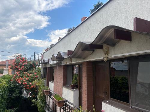 a building with an awning on the side of it at Casa Elisabeta Constanta in Constanţa