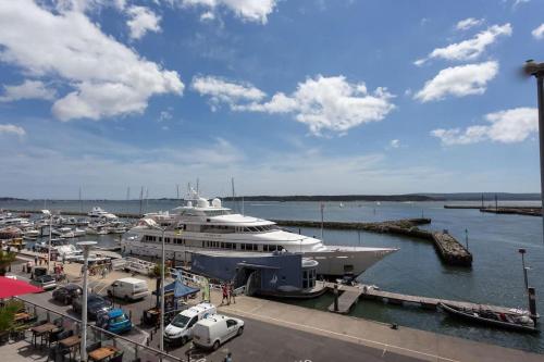 a large yacht is docked at a dock at Panorama - 180-Degree Harbour Views in Poole