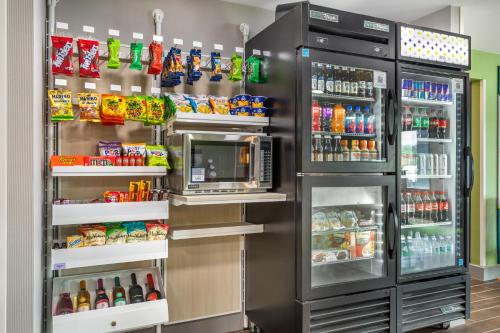 a refrigerator filled with lots of food and drinks at Spark by Hilton Knoxville North I-75 in Knoxville