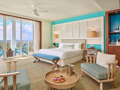 a bedroom with a bed and a living room at Margaritaville Hollywood Beach Resort in Hollywood