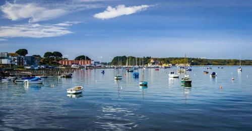 a bunch of boats floating on the water at Castle Lanes - Minutes from Poole Quay, Poole Town Location in Poole