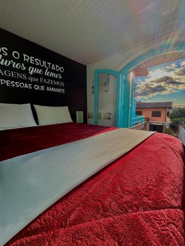 Cama o camas de una habitación en Casa do Rogério Hostel