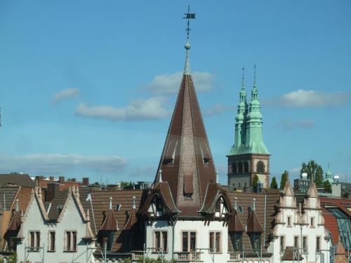 a group of buildings with a tower and a church at Vorderer Westen Kassel in Kassel