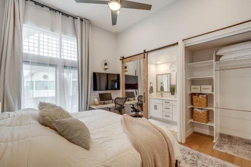 a bedroom with a white bed and a large window at 1 Mi to Coast Family-Friendly Gem in Solana Beach in Solana Beach