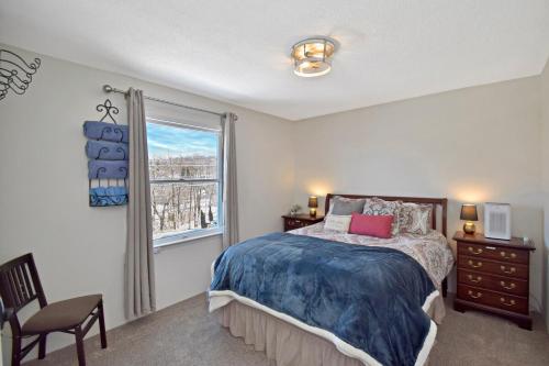 a bedroom with a bed and a window at Ski Resort Backyard Walk to Lifts Brewery Coffee in Beech Mountain