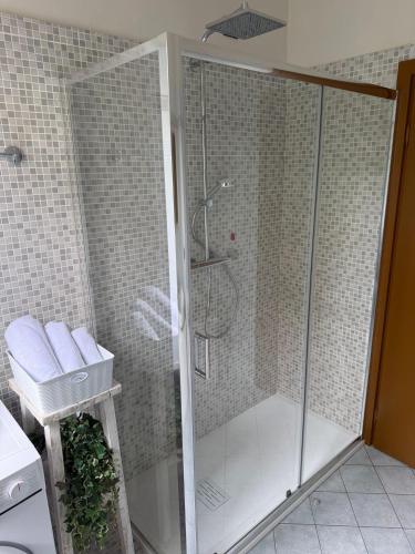 a shower with a glass door in a bathroom at Cà del Fili in Lenno