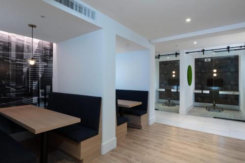 a dining room with a table and two chairs at Revela Mountain View in Mountain View