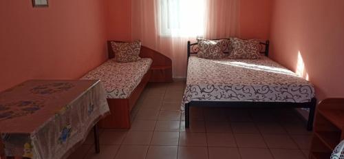 Кровать или кровати в номере Золотий Якір