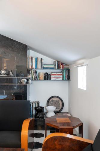 a living room with a table and a couch at AMORE RENTALS - The Roof in Sorrento
