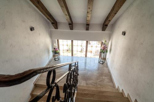 a staircase in a building with flowers on the wall at NEW Gästehaus Flora,Kitchen,TV,Free Parking,near Europa Park and Strasbourg in Hohberg
