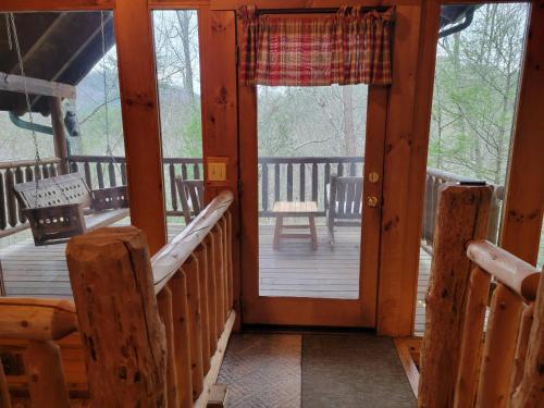 a view of the front door of a cabin at Simply Charming in Pigeon Forge