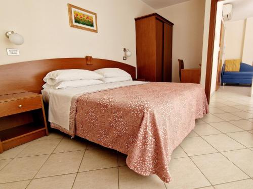 Postel nebo postele na pokoji v ubytování Residence Ducale