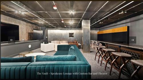 a living room with a couch and tables and chairs at Historic Charm meet Modern Amenities in Tacoma