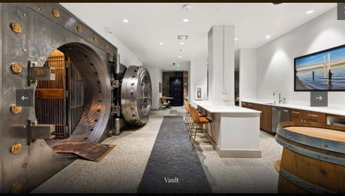 a wine tasting room with a bunch of wine barrels at Historic Charm meet Modern Amenities in Tacoma