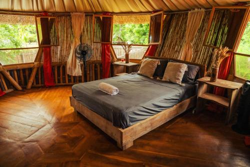 Postel nebo postele na pokoji v ubytování Bambuk Bio Chalet