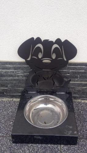 a metal toilet with a mickey mouse head on it at Zacisze Deluxe - Apartamenty in Krościenko