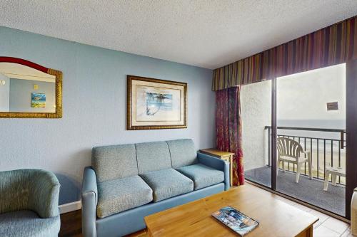 a living room with a couch and a view of the ocean at Monterey Bay 617 in Myrtle Beach