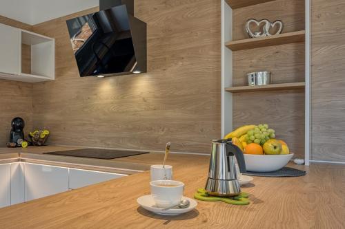 a kitchen with a bowl of fruit on a counter at Casa Mia in Rebići