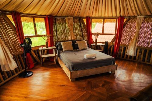 Postel nebo postele na pokoji v ubytování Bambuk Bio Chalet