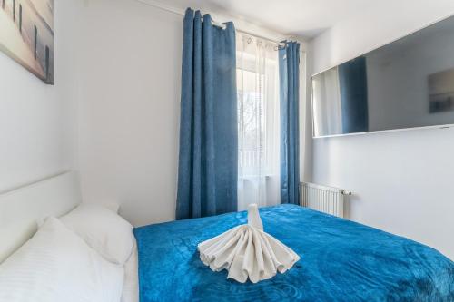 Postel nebo postele na pokoji v ubytování Feniks Seaside Apartment with Pool & near Beach