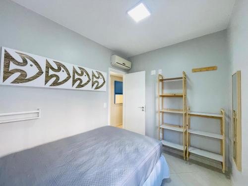 En eller flere senge i et værelse på Brisa do mar Riviera de São Lourenço