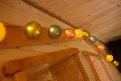 a wooden shelf with christmas ornaments on it at Au pied du frêne in Herzeele