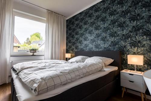 En eller flere senge i et værelse på Stilvolle & Helle Wohnung