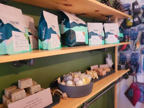 a store shelf with a bunch of bread and cheese at Motel Abricafé in Stoneham