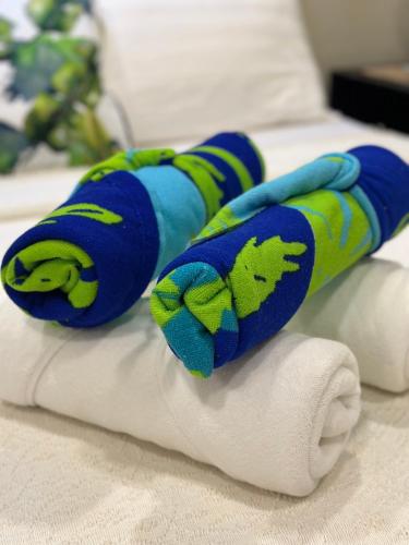 a pair of socks on top of a bed at Kawayan Terrace - Boracay in Boracay