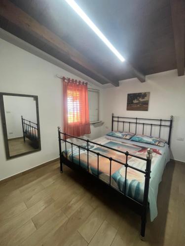 Ένα ή περισσότερα κρεβάτια σε δωμάτιο στο Casa Vacanza Tramontana
