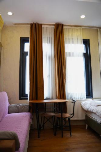 a living room with a couch and a table at Family Hotel Taksim in Istanbul