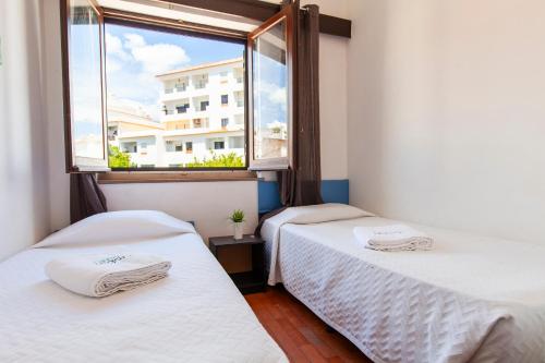 Postel nebo postele na pokoji v ubytování Seacliff Albufeira