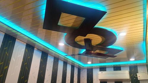 a chandelier hanging from the ceiling in a restroom at vaidehi homlee premium stay, 3kms from Shri Ram janmbhoomi, Ayodhya in Faizābād
