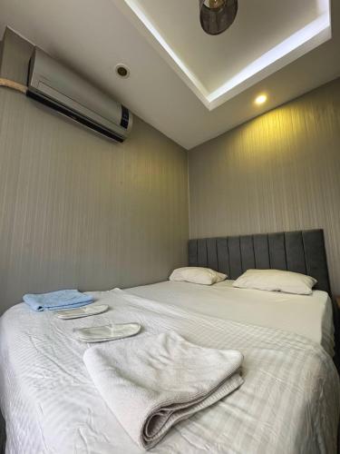 a bedroom with two beds with towels on them at Family Hotel Taksim in Istanbul