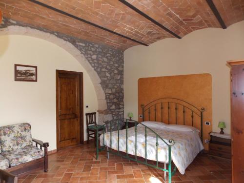 Кровать или кровати в номере Poggio Mario