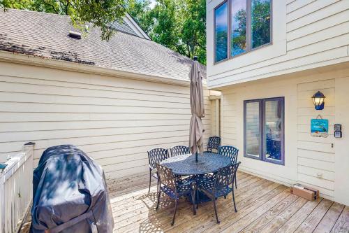 a patio with a table and chairs and an umbrella at Spinnaker 780 in Seabrook Island