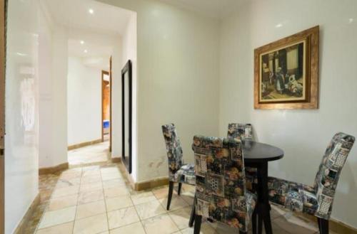 a dining room with a table and chairs at Palmeraie Village 2 in Marrakesh