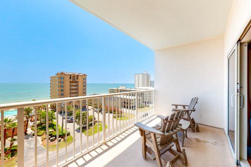 a balcony with chairs and a view of the ocean at Crystal Tower 705 in Gulf Shores