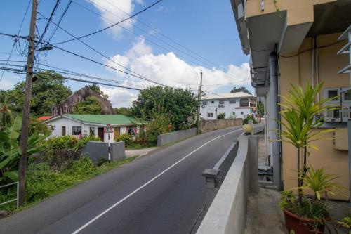 an empty street in a town with houses at Soleil Levant in Victoria